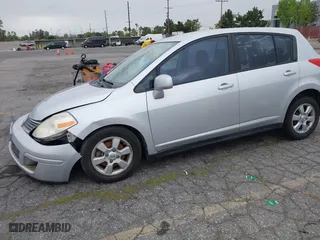 2009 Nissan Versa 1.8 S with VIN 3N1BC13E09L406828, listed as a IAAI auction lot 42075391 with 136,671 mi miles. Bid and sale history available at carsss.com. Image 2.