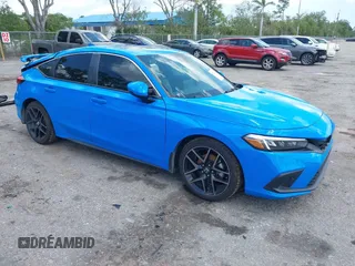 2023 Honda Civic Sport Touring z VIN 19XFL1H84PE002868, wystawiony jako IAAI lot #41978174 z przebiegiem 42 604 mil mil oraz . Historia ofert i sprzedaży dostępna na DreamBid. Obrazek 1.