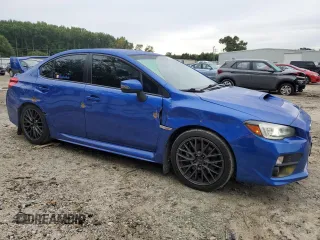 2015 Subaru WRX STI with VIN JF1VA2L69F9837435, listed as a Copart auction lot 73206354 with 57,811 mi miles and Salvage title. Bid and sale history available at DreamBid. Image 4.