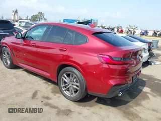 2021 BMW X4 xDrive30i with VIN 5UX2V1C09M9F29509, listed as a IAAI auction lot 42408605 with 46,992 mi miles and . Bid and sale history available at DreamBid. Image 3.