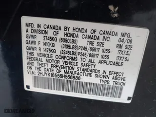 2006 Honda Ridgeline RTL with VIN 2HJYK16556H566886, listed as a IAAI auction lot 42077035 with 124,310 mi miles. Bid and sale history available at carsss.com. Image 9.