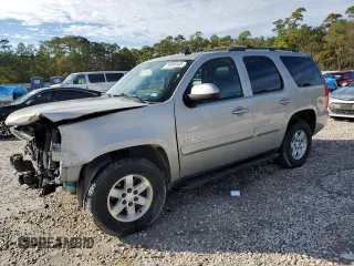 2009 GMC Yukon SLT w/4SA with VIN 1GKFC33J99R148006, listed as a Copart auction lot 88668535 with 145,088 mi miles and Salvage Title. Bid and sale history available at carsss.com. Image 1.