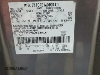 2010 Ford F-150 XL with VIN 1FTEX1CW0AFB44606, listed as a Copart auction lot 56570045 with 166,448 mi miles and Salvage title. Bid and sale history available at DreamBid. Image 12.