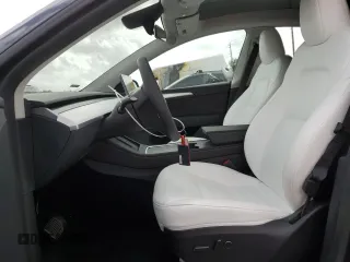 2025 Tesla Model Y Long Range with VIN 7SAYGDED6SF228626, listed as a Copart auction lot 47654525 with 2,087 mi miles and Salvage Title. Bid and sale history available at DreamBid. Image 7.