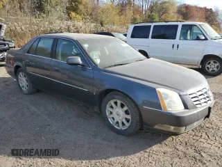 2009 Cadillac DTS 1SC z VIN 1G6KD57Y39U129722, wystawiony jako Copart lot #77071164 z przebiegiem 133 769 mil mil oraz Czysty tytuł • Clean title. Historia ofert i sprzedaży dostępna na DreamBid. Obrazek 4.