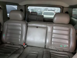 2003 Hummer H2 with VIN 5GRGN23U83H143843, listed as a Copart auction lot 43792915 with 115,569 mi miles and Salvage Title. Bid and sale history available at carsss.com. Image 10.