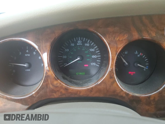 2002 Jaguar XK with VIN SAJDA42C22NA23724, listed as a Copart auction lot 53521005 with 61,468 mi miles and Salvage Title. Bid and sale history available at DreamBid. Image 9.