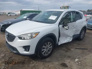 2016 Mazda CX-5 Touring with VIN JM3KE2CY5G0791537, listed as a IAAI auction lot 41396276 with 42,095 mi miles. Bid and sale history available at carsss.com. Image 18.