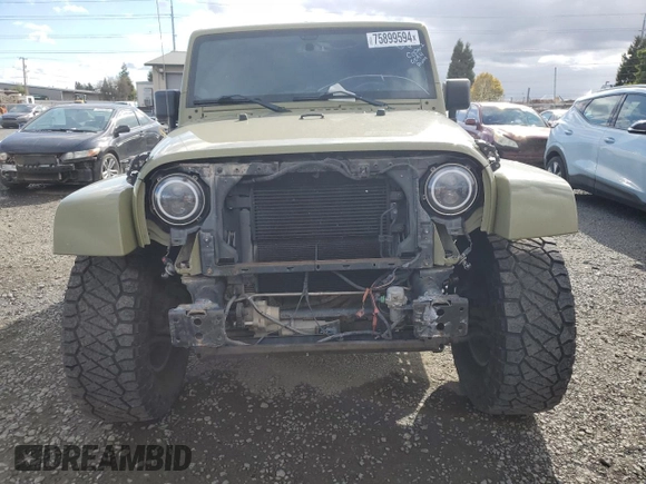 2013 Jeep Wrangler Unlimited Rubicon 10th Anniversary with VIN 1C4HJWFG4DL549065, listed as a Copart auction lot 75899594 with 127,960 mi miles and Salvage title. Bid and sale history available at DreamBid. Image 5.