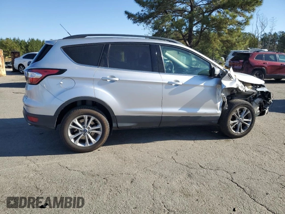 2018 Ford Escape SE z VIN 1FMCU9G96JUB49271, wystawiony jako Copart lot #50553205 z przebiegiem 91 123 mil mil oraz Szkoda całkowita • Salvage title. Historia ofert i sprzedaży dostępna na DreamBid. Obrazek 3.