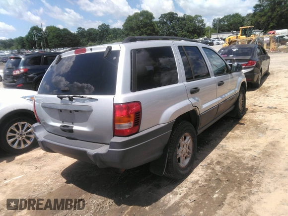 2004 Jeep Grand Cherokee Laredo z VIN 1J4GW48SX4C309998, wystawiony jako IAAI lot #42307167 z przebiegiem 306 912 mil mil oraz . Historia ofert i sprzedaży dostępna na DreamBid. Obrazek 4.