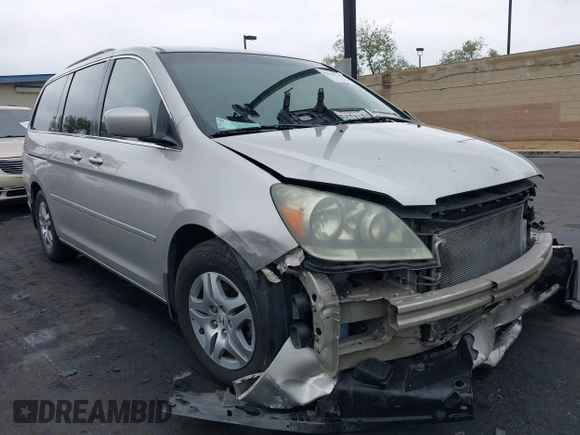2007 Honda Odyssey EX-L with VIN 5FNRL38687B423865, listed as a IAAI auction lot 42190749 with 215,664 mi miles and . Bid and sale history available at DreamBid. Image 1.