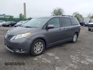 2014 Toyota Sienna XLE with VIN 5TDYK3DC0ES436502, listed as a IAAI auction lot 42180990 with 154,839 mi miles and . Bid and sale history available at DreamBid. Image 2.