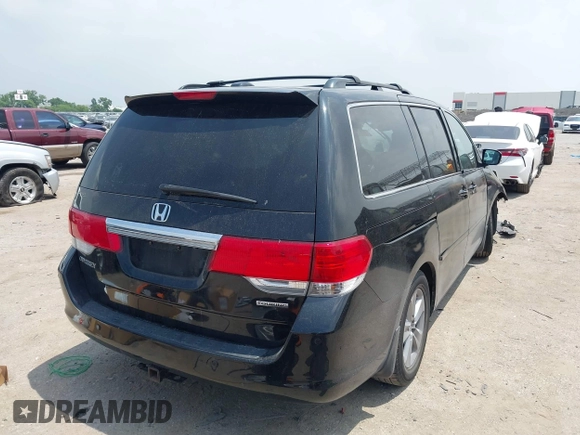2010 Honda Odyssey Touring с VIN 5FNRL3H90AB070720, выставлен на аукционе IAAI как лот 42335181 с пробегом 145 205 миль миль и . История ставок и продаж доступна на DreamBid. Изображение 4.