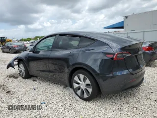 2024 Tesla Model Y with VIN 7SAYGDED2RF040079, listed as a Copart auction lot 57237054 with 2,549 mi miles and Non Repairable. Bid and sale history available at DreamBid. Image 2.