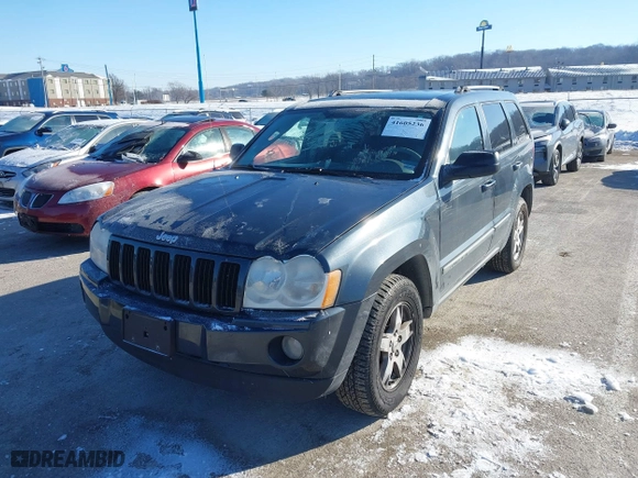 2007 Jeep Grand Cherokee Laredo with VIN 1J8GS48K97C538509, listed as a IAAI auction lot 41605236 with 164,530 mi miles. Bid and sale history available at carsss.com. Image 2.