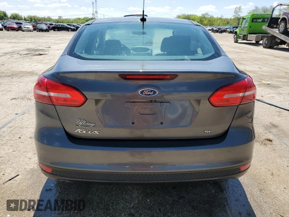 2018 Ford Focus SE z VIN 1FADP3F20JL257320, wystawiony jako Copart lot #55956435 z przebiegiem 26 919 mil mil oraz Szkoda całkowita • Salvage title. Historia ofert i sprzedaży dostępna na DreamBid. Obrazek 6.