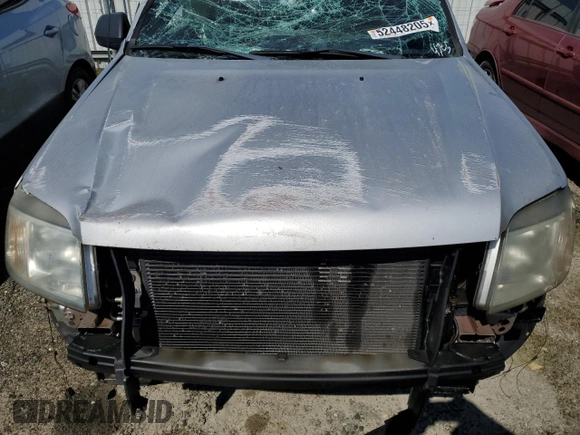 2008 Mercury Mariner z VIN 4M2CU81Z58KJ47051, wystawiony jako Copart lot #52448205 z przebiegiem 189 870 mil mil oraz Szkoda całkowita • Salvage title. Historia ofert i sprzedaży dostępna na DreamBid. Obrazek 12.