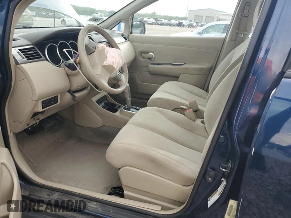 2009 Nissan Versa S with VIN 3N1BC11E19L433572, listed as a Copart auction lot 54084215 with 144,178 mi miles and Salvage title. Bid and sale history available at DreamBid. Image 7.