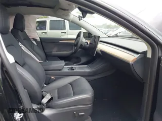 2023 Tesla Model Y Long Range with VIN 7SAYGAEE8PF928923, listed as a IAAI auction lot 41880988 with 18,468 mi miles. Bid and sale history available at carsss.com. Image 5.