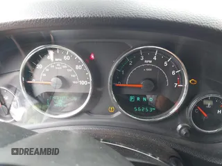 2015 Jeep Wrangler Sahara with VIN 1C4AJWBG9FL663959, listed as a IAAI auction lot 42133900 with 56,253 mi miles and . Bid and sale history available at DreamBid. Image 7.