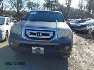 2011 Honda Pilot EX-L with VIN 5FNYF3H66BB018616, listed as a IAAI auction lot 41449001 with 221,499 mi miles and . Bid and sale history available at DreamBid. Image 11.