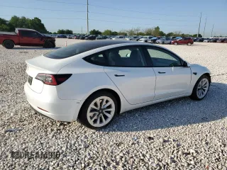 2023 Tesla Model 3 with VIN 5YJ3E1EA4PF631304, listed as a Copart auction lot 52500695 with 33,024 mi miles and Salvage title. Bid and sale history available at DreamBid. Image 3.