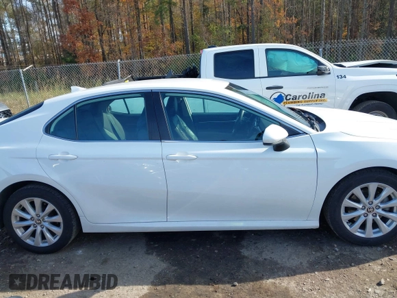 2020 Toyota Camry LE with VIN 4T1C11AKXLU986310, listed as a IAAI auction lot 40977100 with 108,208 mi miles and . Bid and sale history available at DreamBid. Image 13.