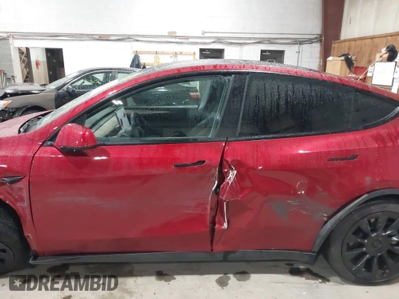 2024 Tesla Model Y Long Range with VIN 7SAYGAEE2RF986206, listed as a IAAI auction lot 42177852 with 14,399 mi miles and . Bid and sale history available at DreamBid. Image 18.