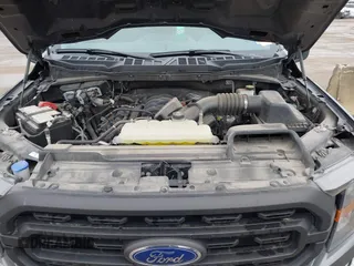 2023 Ford F-150 XL with VIN 1FTMF1C58PKF77242, listed as a IAAI auction lot 41559887 with 25,576 mi miles and . Bid and sale history available at carsss.com. Image 10.