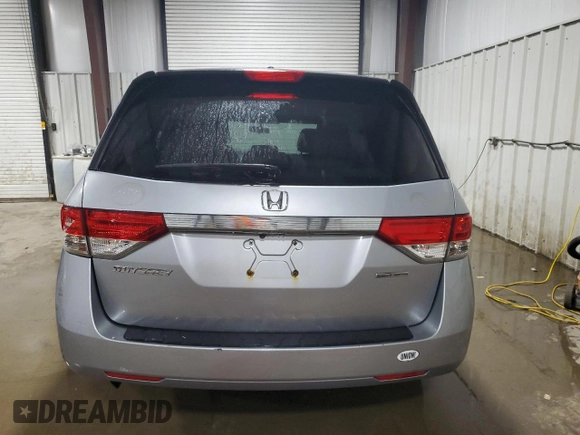2016 Honda Odyssey SE with VIN 5FNRL5H31GB109718, listed as a Copart auction lot 54689915 with 48,933 mi miles and Salvage Title. Bid and sale history available at DreamBid. Image 6.