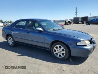 2002 Mazda 626 LX with VIN 1YVGF22C825293243, listed as a Copart auction lot 61084684 with 217,339 mi miles and Salvage Title. Bid and sale history available at carsss.com. Image 4.