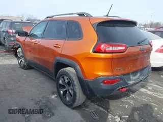 2015 Jeep Cherokee Trailhawk with VIN 1C4PJMBB3FW642266, listed as a IAAI auction lot 41510571 with 72,030 mi miles and . Bid and sale history available at DreamBid. Image 3.