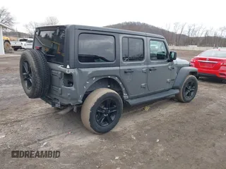 2021 Jeep Wrangler Unlimited Sport Altitude with VIN 1C4HJXDG1MW603784, listed as a IAAI auction lot 41509231 with 102,567 mi miles and . Bid and sale history available at DreamBid. Image 4.