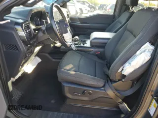 2021 Ford F-150 XL with VIN 1FTFW1E55MFA77310, listed as a Copart auction lot 56179055 with 48,990 mi miles and Salvage title. Bid and sale history available at DreamBid. Image 7.