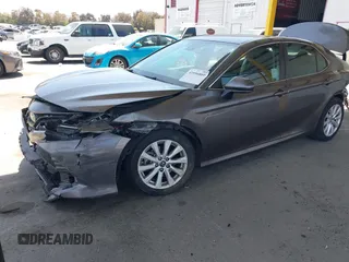 2019 Toyota Camry LE with VIN 4T1B11HK8KU204599, listed as a IAAI auction lot 42096889 with 76,518 mi miles and . Bid and sale history available at DreamBid. Image 18.