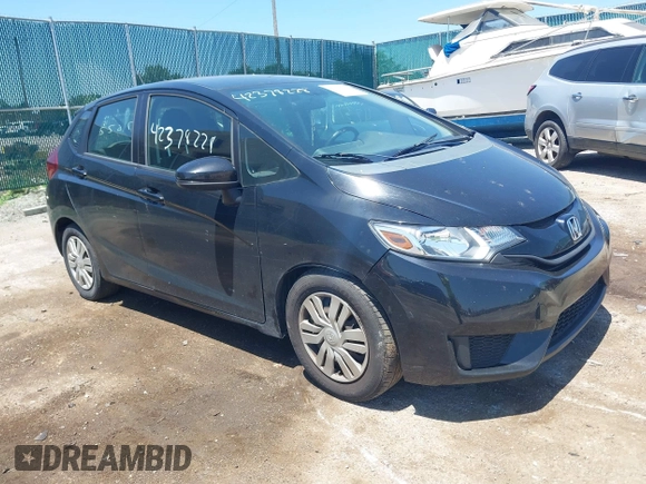 2015 Honda Fit LX z VIN 3HGGK5H56FM712266, wystawiony jako IAAI lot #42378228 z przebiegiem 140 423 mil mil oraz . Historia ofert i sprzedaży dostępna na DreamBid. Obrazek 1.