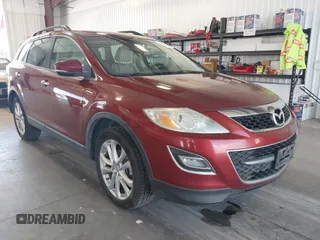 2012 Mazda CX-9 Grand Touring z VIN JM3TB3DAXC0363848, wystawiony jako IAAI lot #42217049 z przebiegiem 203 071 mil mil oraz . Historia ofert i sprzedaży dostępna na DreamBid. Obrazek 1.