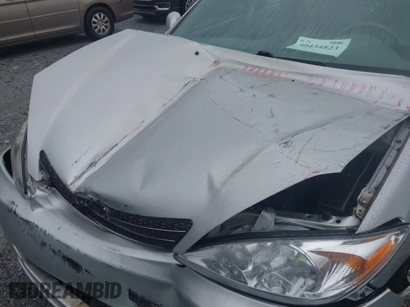 2004 Toyota Camry LE z VIN 4T1BE32KX4U842784, wystawiony jako IAAI lot #40434823 z przebiegiem 119 021 mil mil oraz . Historia ofert i sprzedaży dostępna na DreamBid. Obrazek 10.
