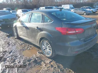2015 Ford Focus Titanium with VIN 1FADP3J28FL348625, listed as a IAAI auction lot 41674741 with 223,585 mi miles and . Bid and sale history available at carsss.com. Image 3.