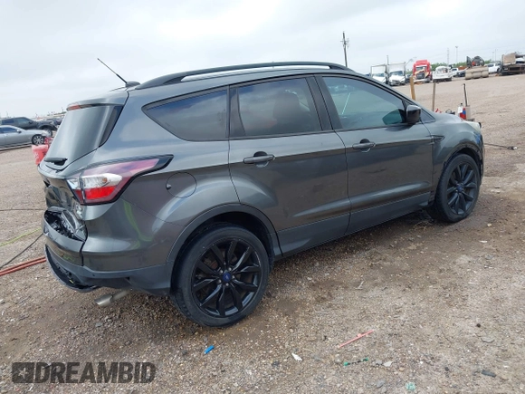 2017 Ford Escape SE with VIN 1FMCU0G99HUC65571, listed as a IAAI auction lot 41923517 with 77,179 mi miles and . Bid and sale history available at DreamBid. Image 4.