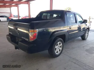 2006 Honda Ridgeline RTL with VIN 2HJYK16556H566886, listed as a IAAI auction lot 42077035 with 124,310 mi miles. Bid and sale history available at carsss.com. Image 4.