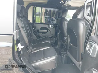 2021 Jeep Gladiator Freedom z VIN 1C6HJTAG4ML586999, wystawiony jako IAAI lot #41911751 z przebiegiem 81 030 mil mil oraz . Historia ofert i sprzedaży dostępna na DreamBid. Obrazek 8.