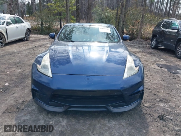 2014 Nissan 370Z Nismo z VIN JN1AZ4EH0EM631950, wystawiony jako IAAI lot #41685567 z przebiegiem 103 282 mil mil oraz . Historia ofert i sprzedaży dostępna na DreamBid. Obrazek 12.