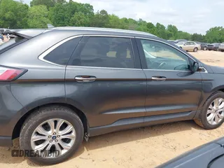 2020 Ford Edge Titanium z VIN 2FMPK4K98LBA76737, wystawiony jako IAAI lot #41981689 z przebiegiem 93 501 mil mil oraz . Historia ofert i sprzedaży dostępna na DreamBid. Obrazek 13.