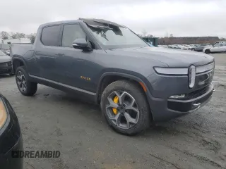 2022 Rivian R1T Adventure z VIN 7FCTGAAA5NN014020, wystawiony jako Copart lot #81367764 z przebiegiem Nie podano mil oraz Szkody całkowita. Historia ofert i sprzedaży dostępna na DreamBid. Obrazek 4.