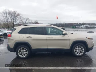 2014 Jeep Cherokee Latitude with VIN 1C4PJLCB8EW191911, listed as a IAAI auction lot 41956728 with 123,643 mi miles. Bid and sale history available at carsss.com. Image 13.