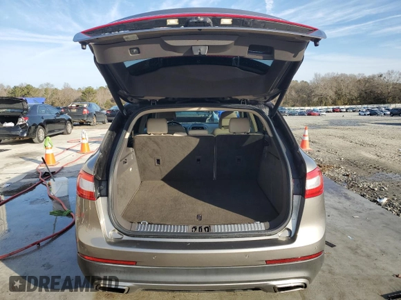 2016 Lincoln MKX Reserve z VIN 2LMPJ6LR7GBL74185, wystawiony jako Copart lot #87799275 z przebiegiem 89 977 mil mil oraz Szkoda całkowita • Salvage title. Historia ofert i sprzedaży dostępna na DreamBid. Obrazek 6.