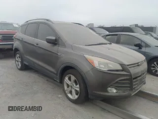 2014 Ford Escape SE with VIN 1FMCU0GXXEUA77765, listed as a IAAI auction lot 40158558 with 88,373 mi miles. Bid and sale history available at carsss.com. Image 1.