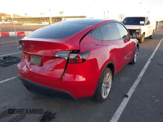 2023 Tesla Model Y Long Range with VIN 7SAYGDEE1PF860207, listed as a IAAI auction lot 41101287 with 24,320 mi miles. Bid and sale history available at carsss.com. Image 4.